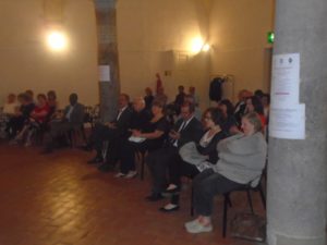 Prof. Sturla, next to the column. To his left Angela Battaglia, Don Aldo Romano